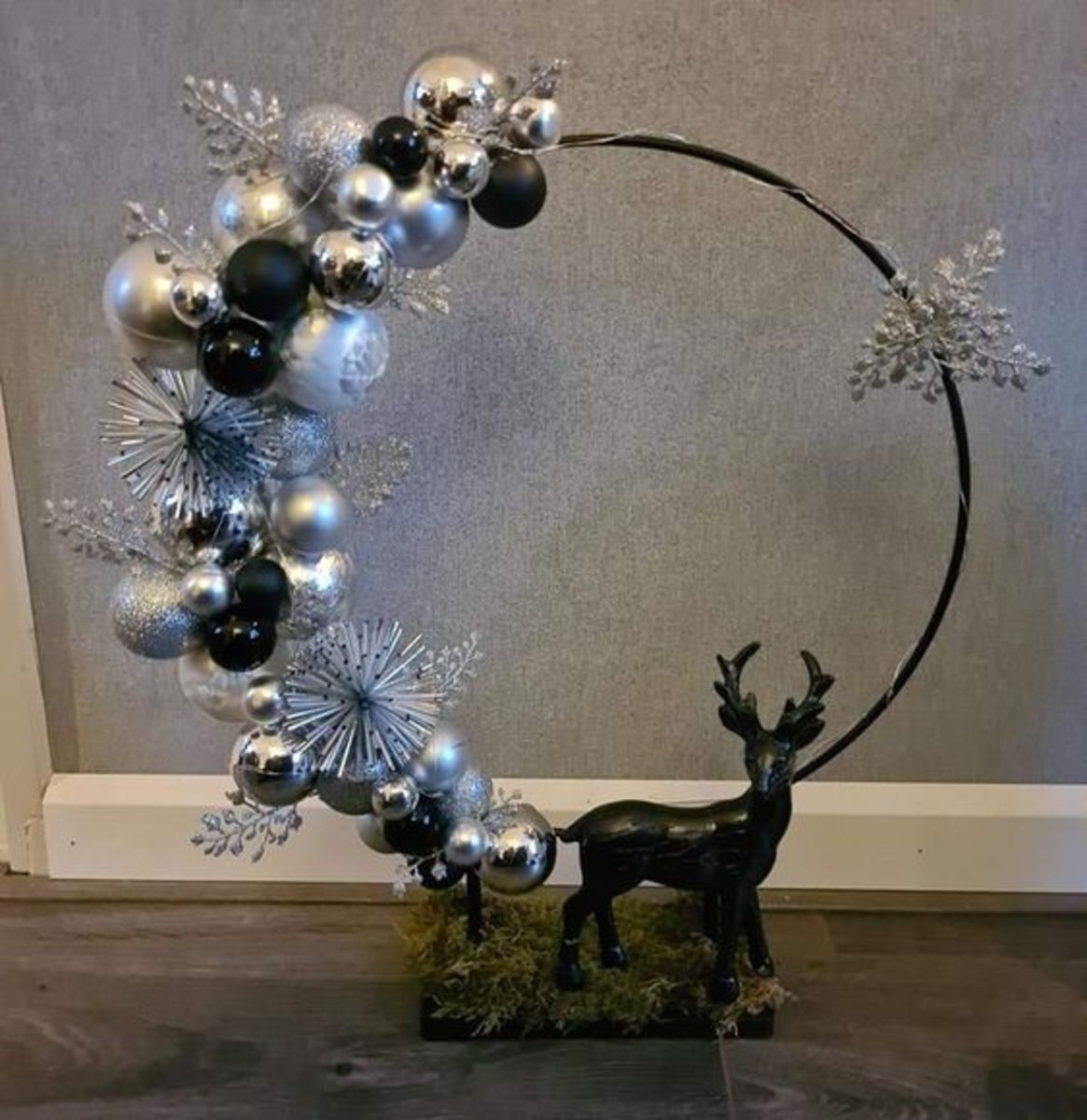 Black and Silver Baubles With Reindeer and String Lights