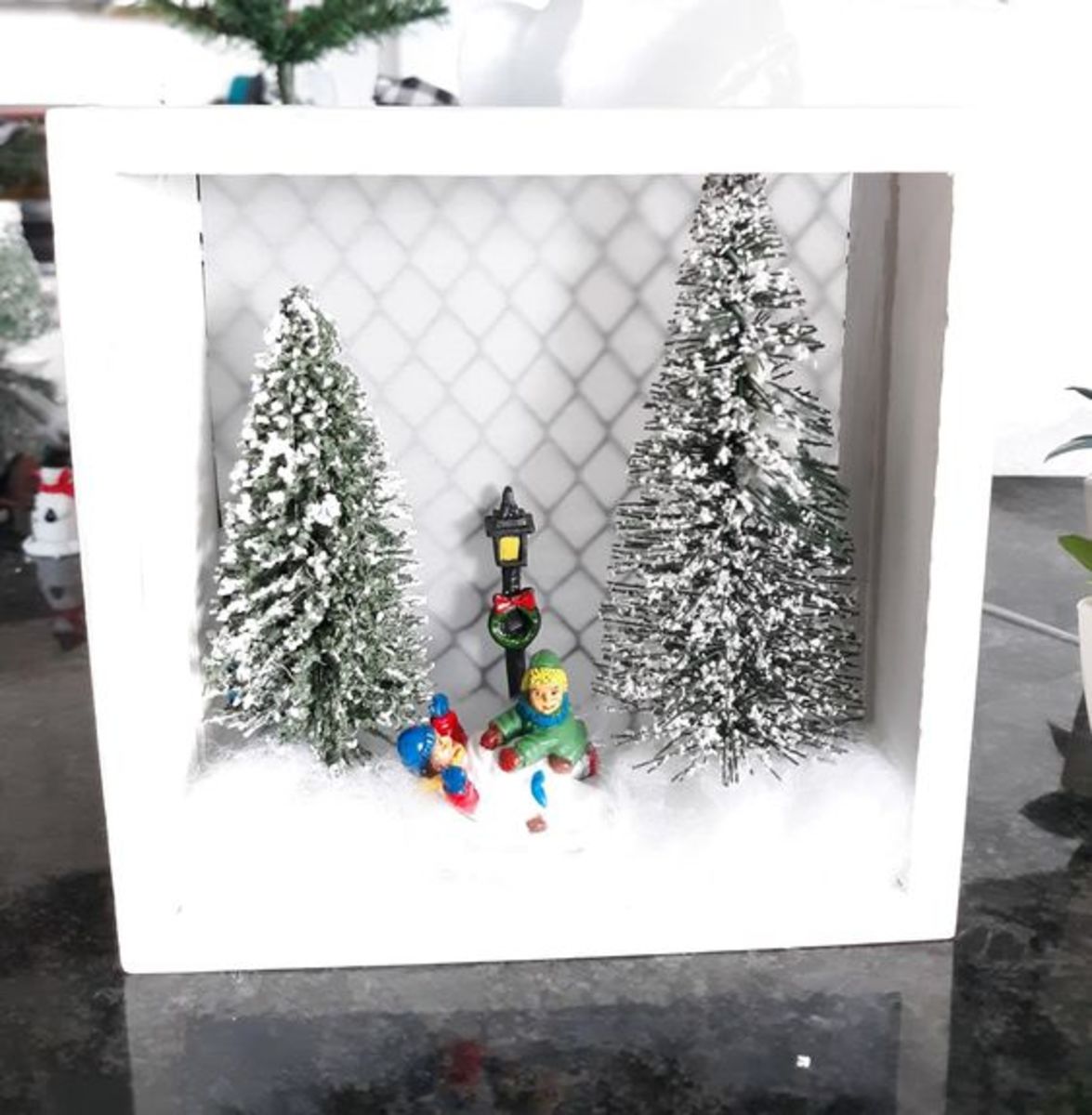 Create an outdoor scene of children playing in the snow.