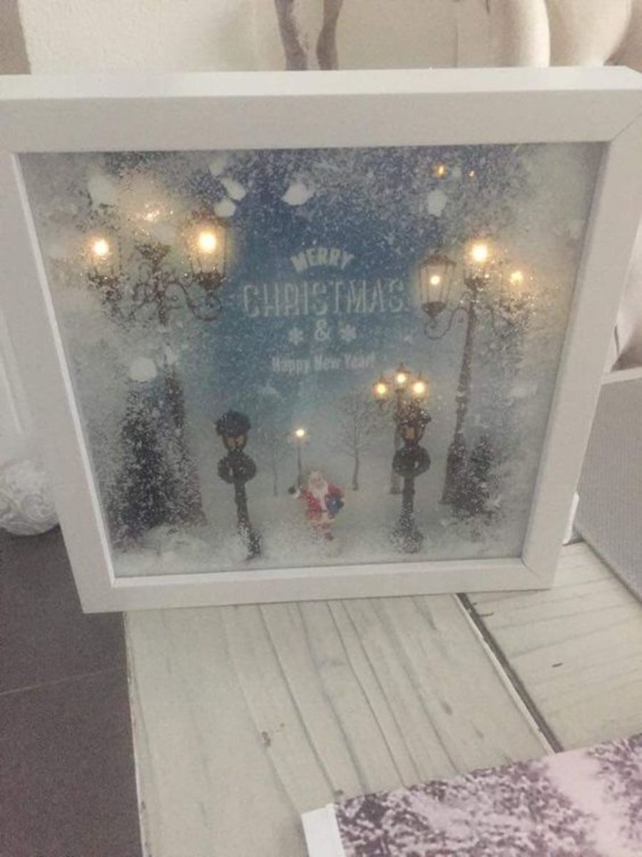 Use some flocking to create a snowy effect in the shadow box.