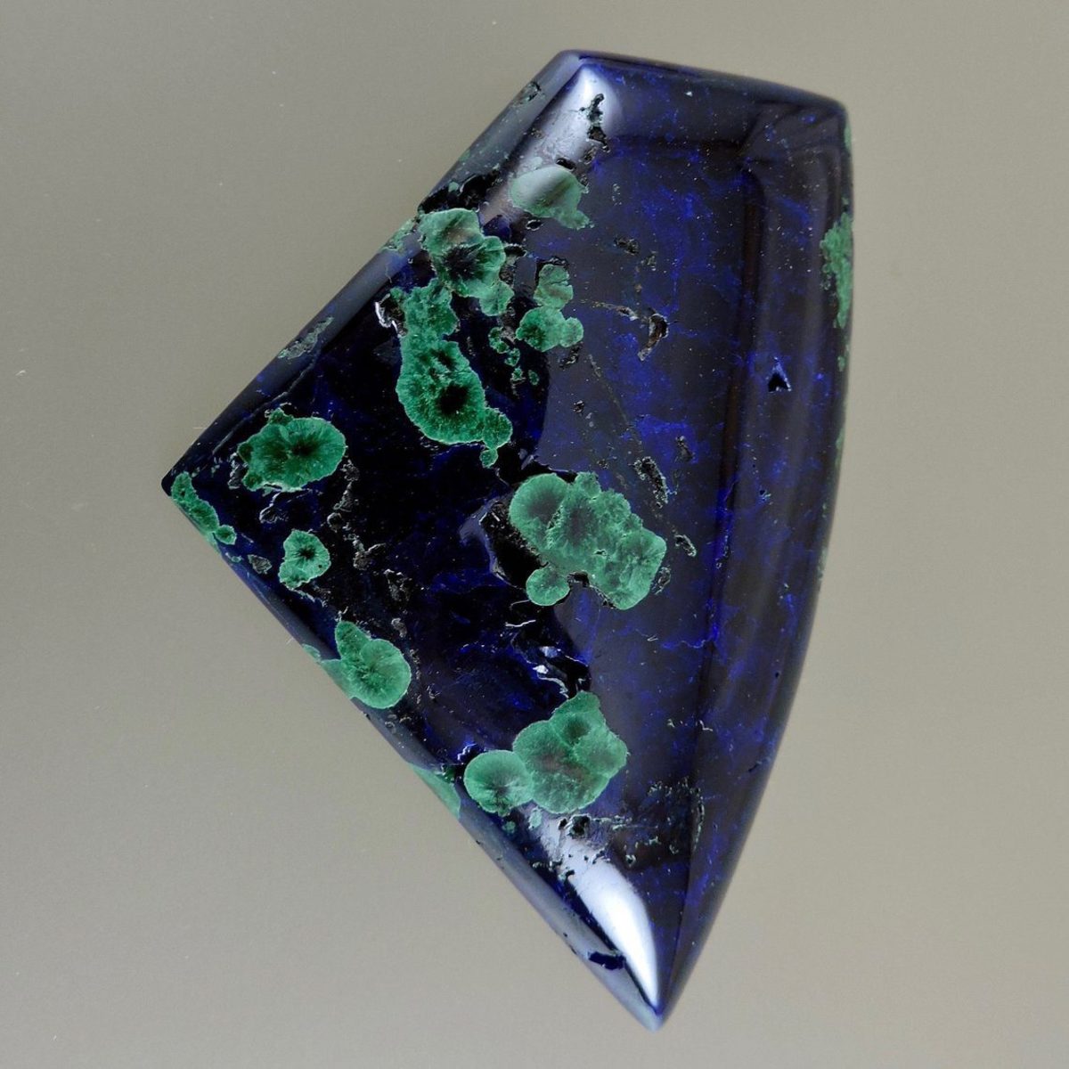 Deep blue azurite cabochon with green malachite