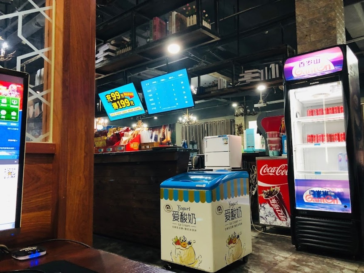 A drinking corner inside a Chinese internet cafe, where you can order a bubble tea to drink while using the computers