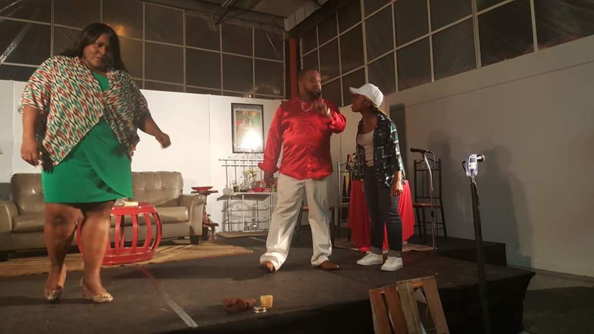 Kimani and her dad acting in a Stage Play