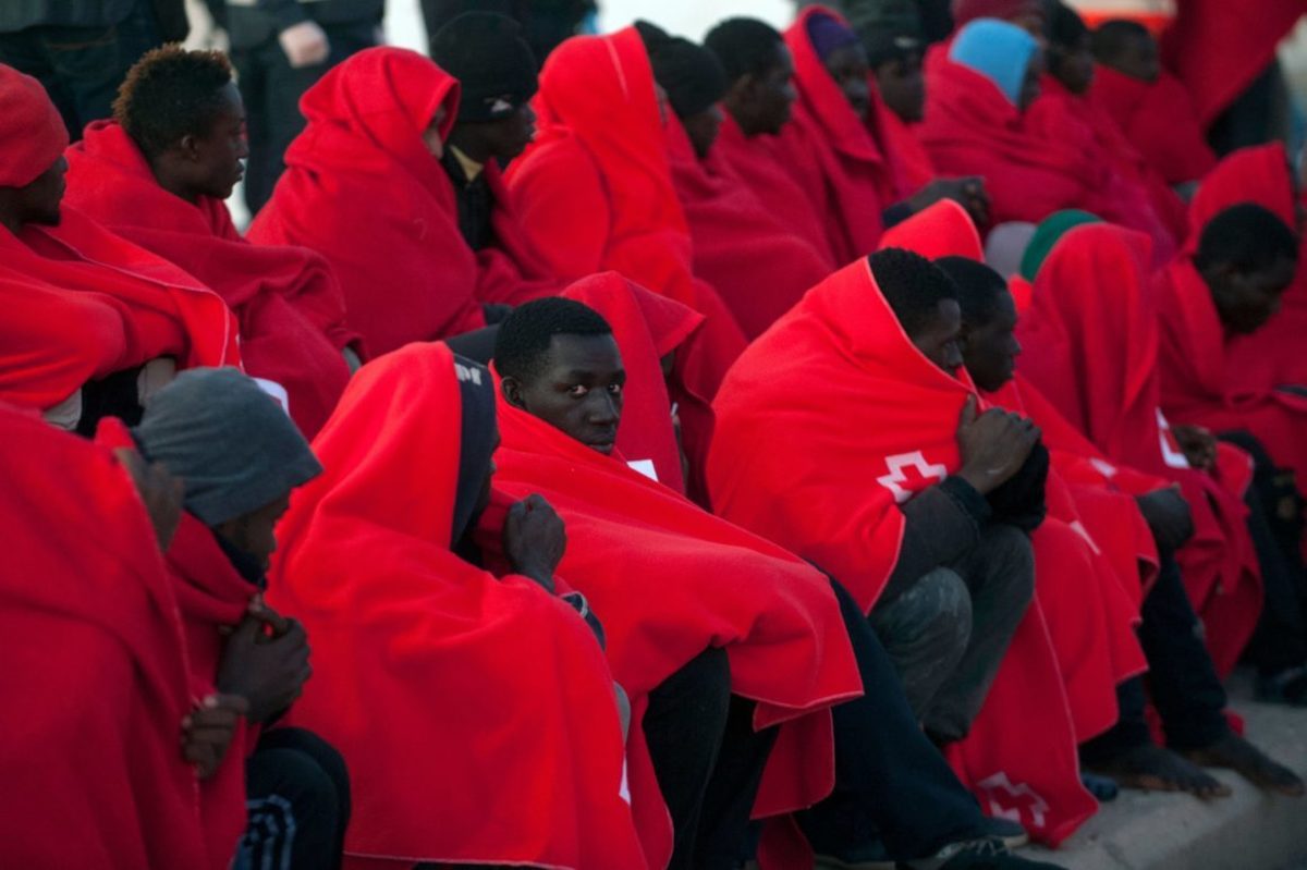 Migrants in Red Cross Blankets on Spanish Border 2017