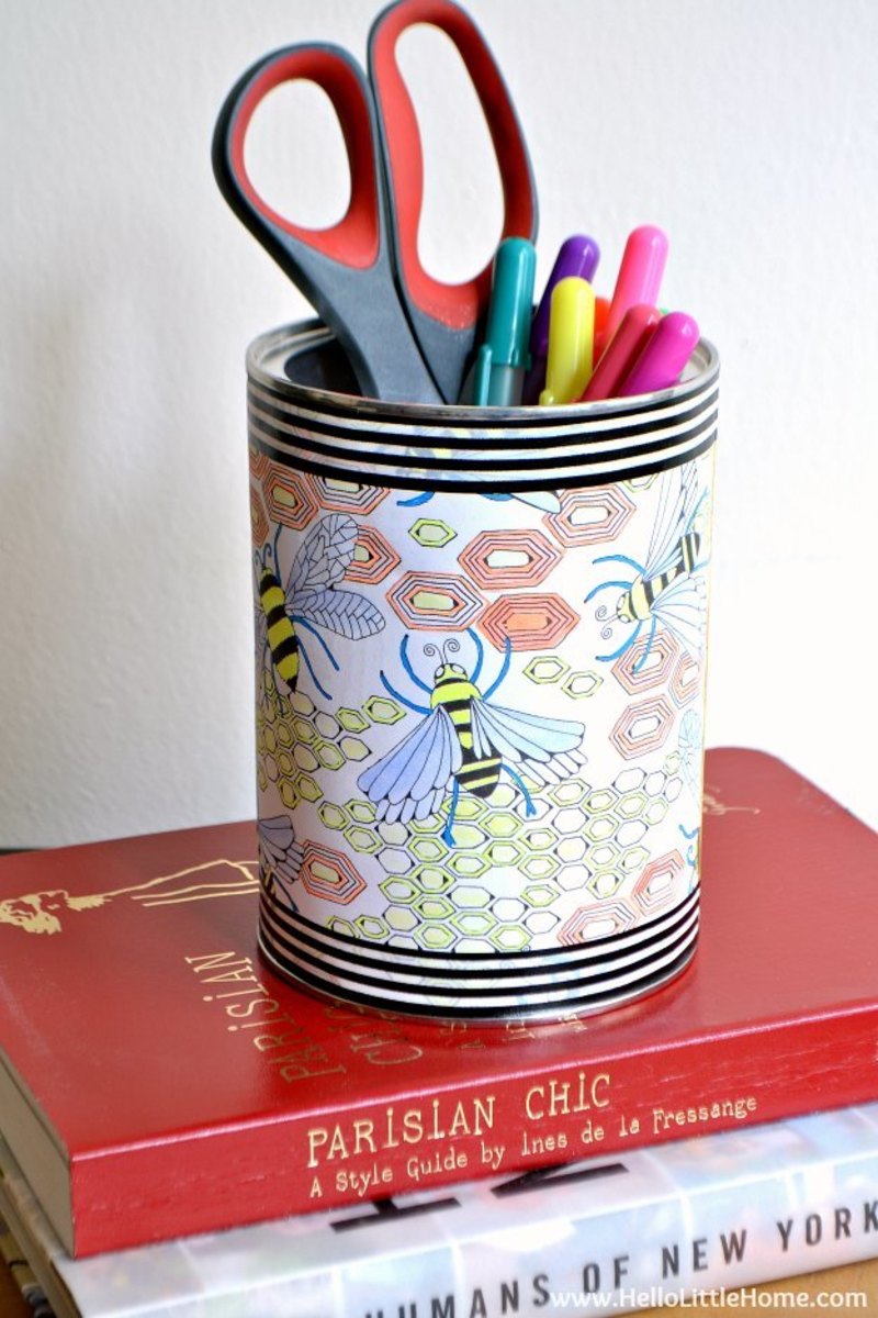 Recycle a tin can into a colorful storage container with a coloring page. Perfect for a child room or a craft space