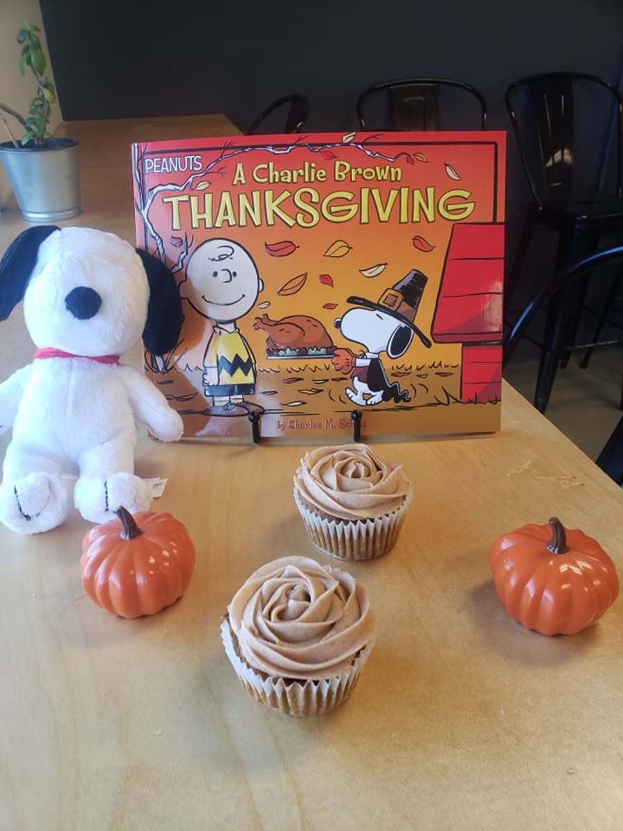 Read  "A Charlie Brown Thanksgiving" with your kids and bake yummy pumpkin cupcakes!
