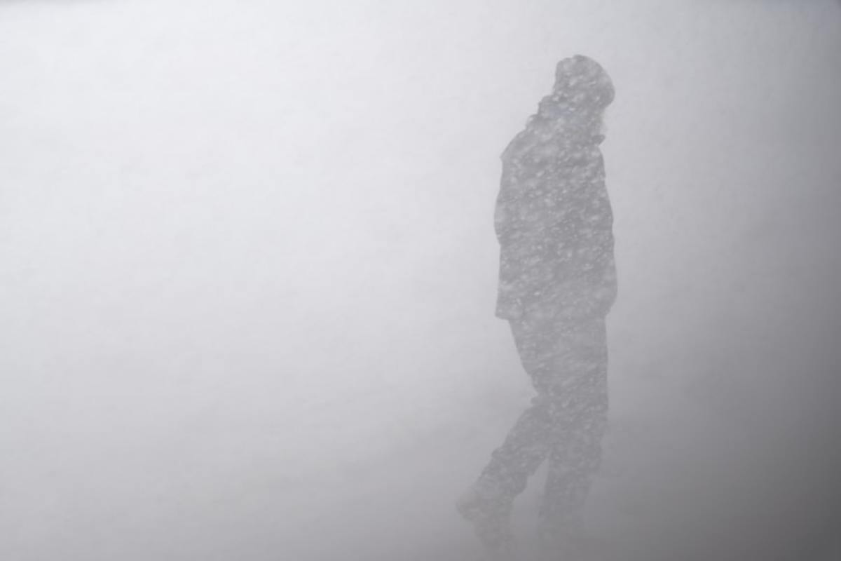 Silhouette of man in snowstorm