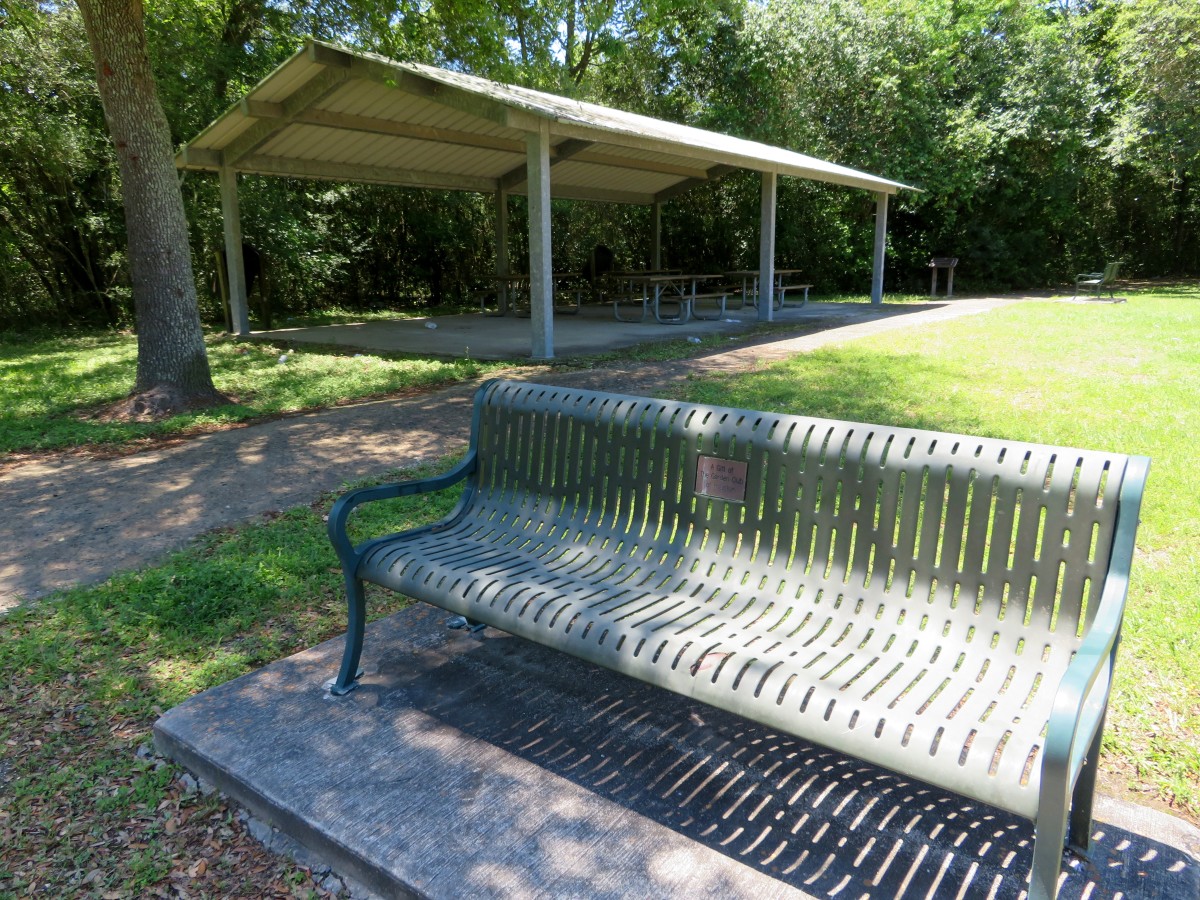 Pavilion, picnic tables, and bench near the parking lot of E.R. and Ann Taylor Park