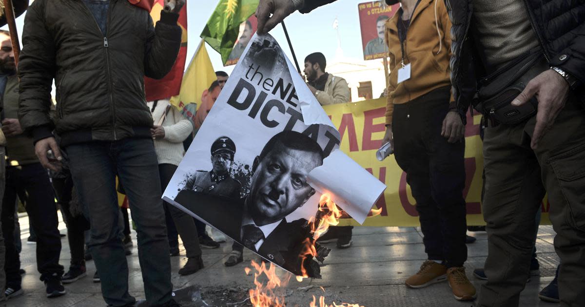 Kurds in Greece burn Erdogan poster