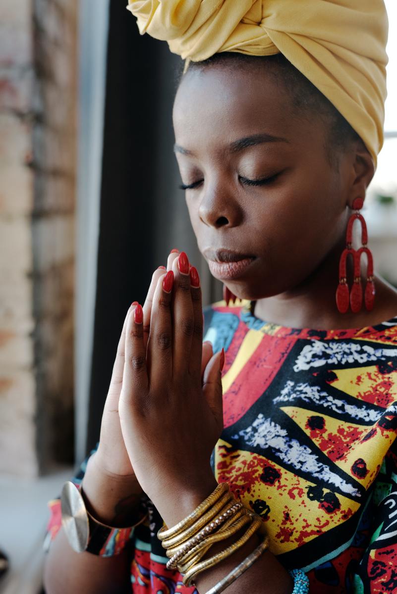 Close-up photo of a woman praying