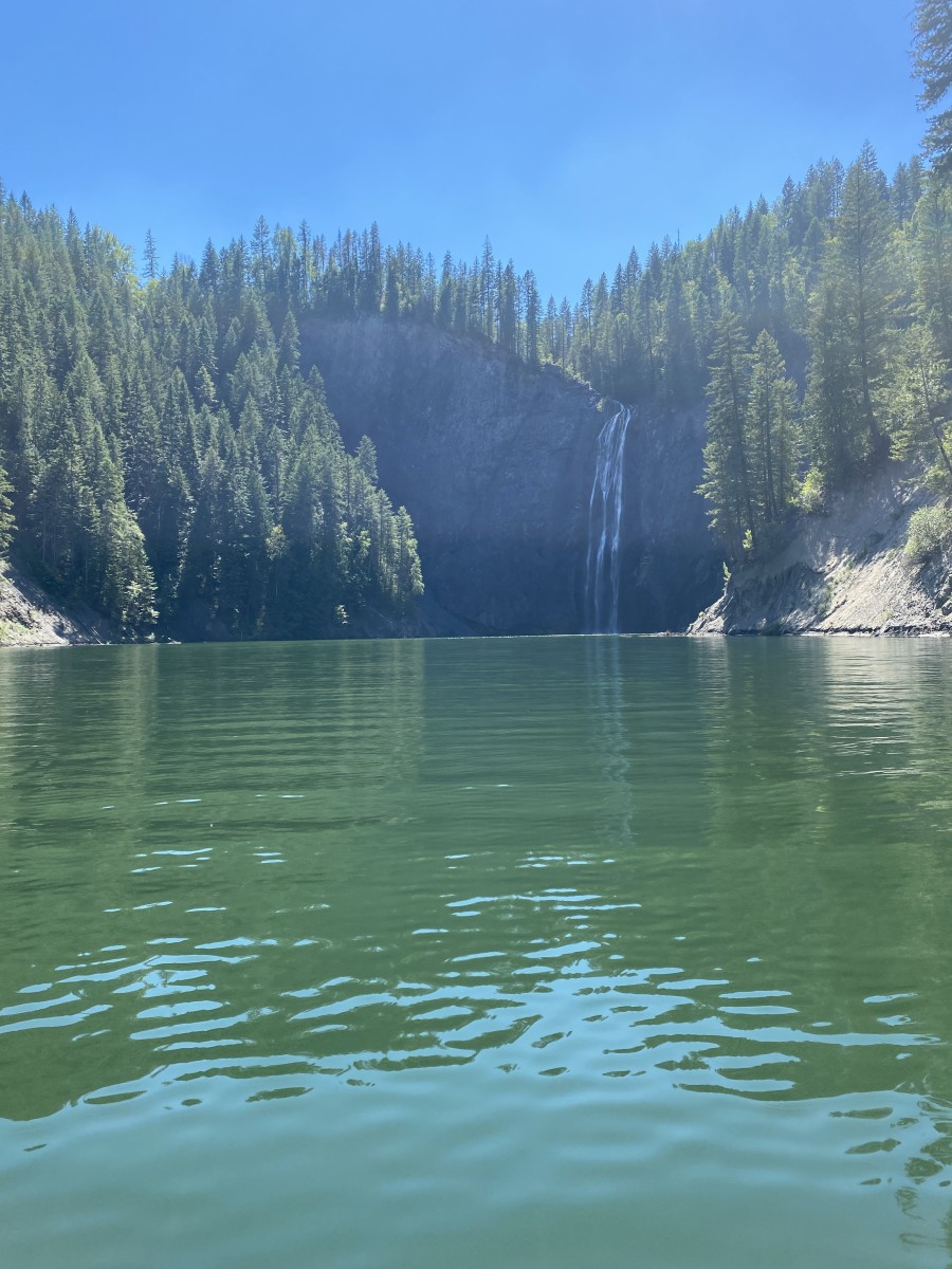The waters of the PeeWee Falls cascade over a sheer cliff into the Pend Oreille River.