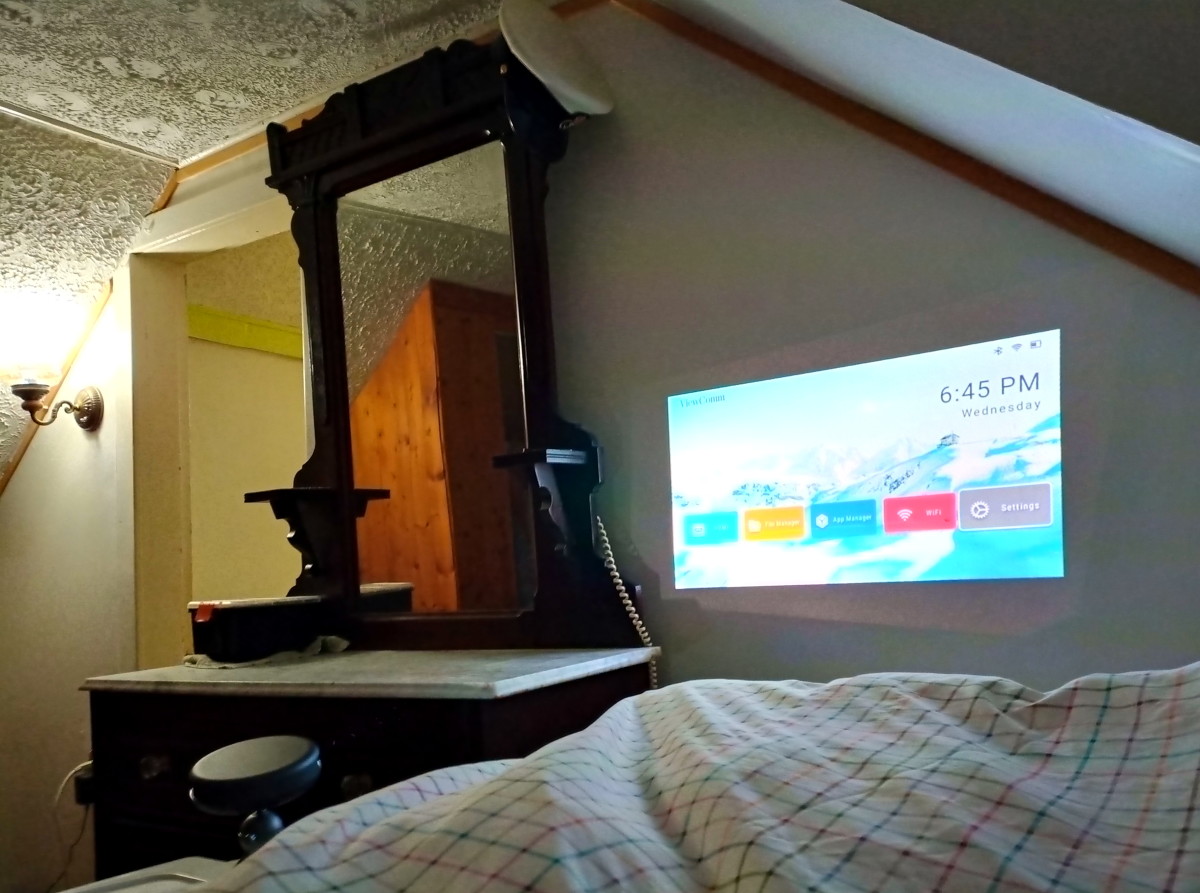 The projector is operating in the main bedroom