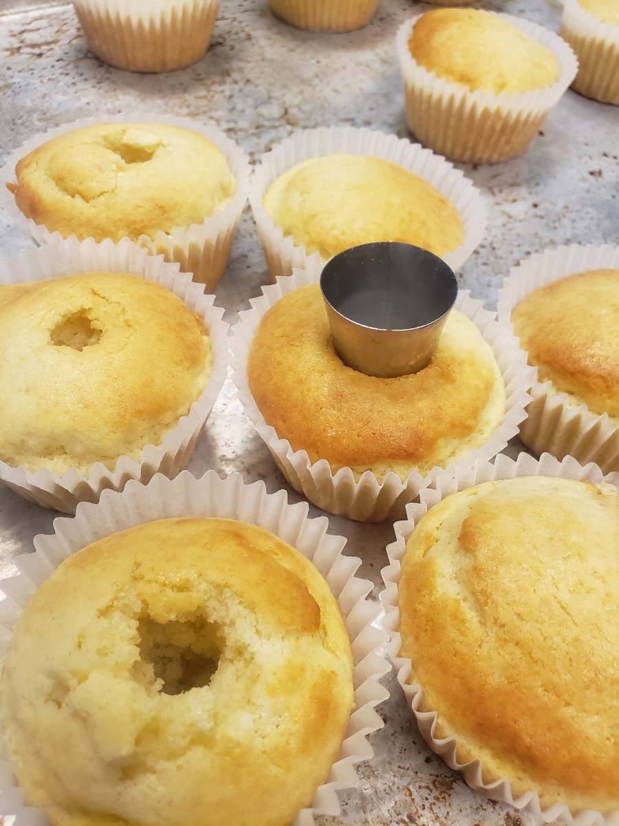 When cupcakes have cooled 10 minutes, I used an XL round piping tip to scoop the centers out of the cucpakes, being careful not to remove the bottom.