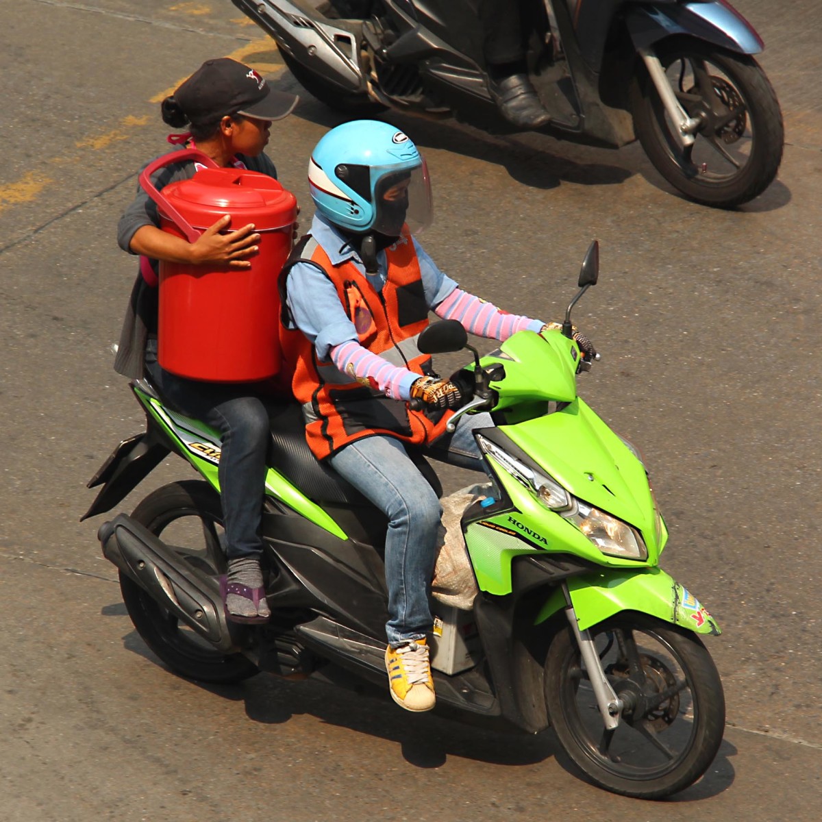Motocycle taxi at work - clearly the limitations on how much you can carry are not too restrictive for this passenger