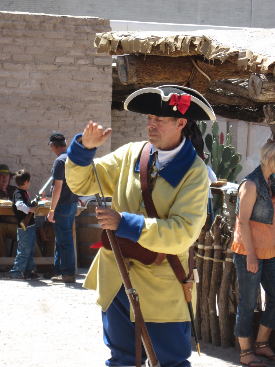 Spanish Soldier at Presidio in Tucson loading his rifle