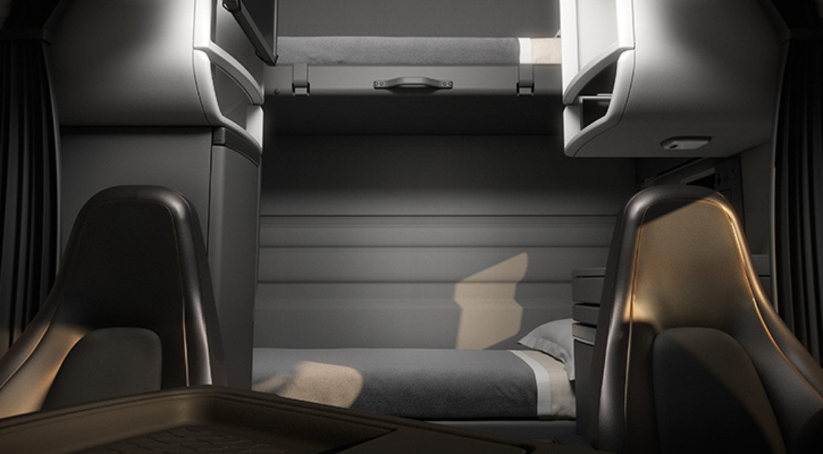 Basic sleeper with bunk beds, cabinets on each side between the front seats and beds. 