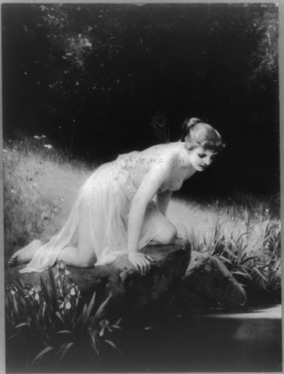 Psyche (A Goddess In Greek mythology) kneeling on the edge of the water. She is thought to be the human soul archetype.