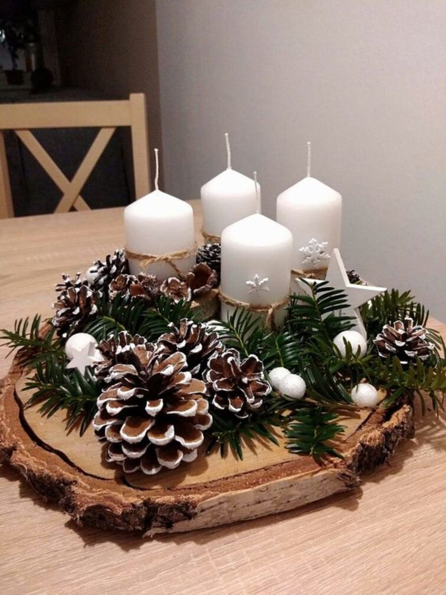 Wood Slice With White Candles and Flocked Pinecones