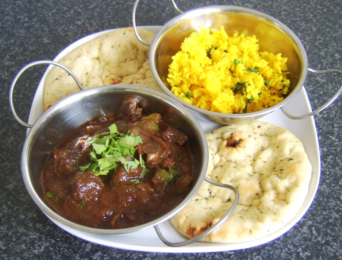 Curried mutton with rice and naan bread