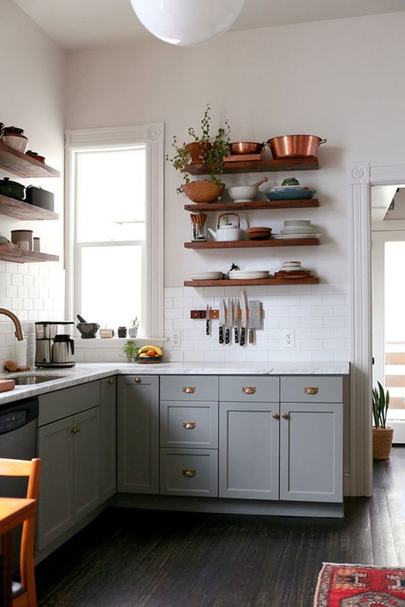 These shelves hold dishes and pots and pans.