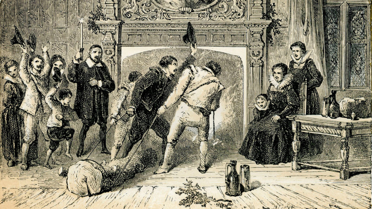 This 1872 illustration depicts the ceremonial lighting of the Yule Log on Christmas Eve