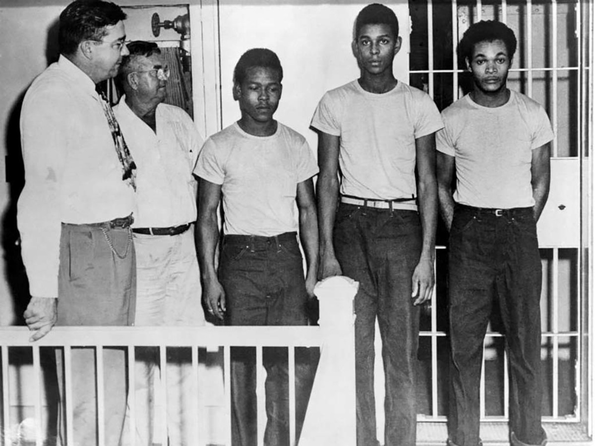 Left to right are Sheriff Willis McCall, Jailer Reuben Hatcher, and the accused Walter Irvin, Charles Greenlee, and Samuel Shepherd.