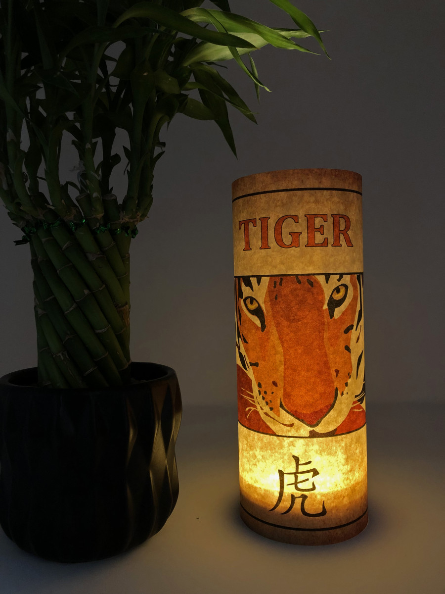 This lantern is a snap to make. Simply print out one of the templates below, glue into a cylinder, and place a light inside.