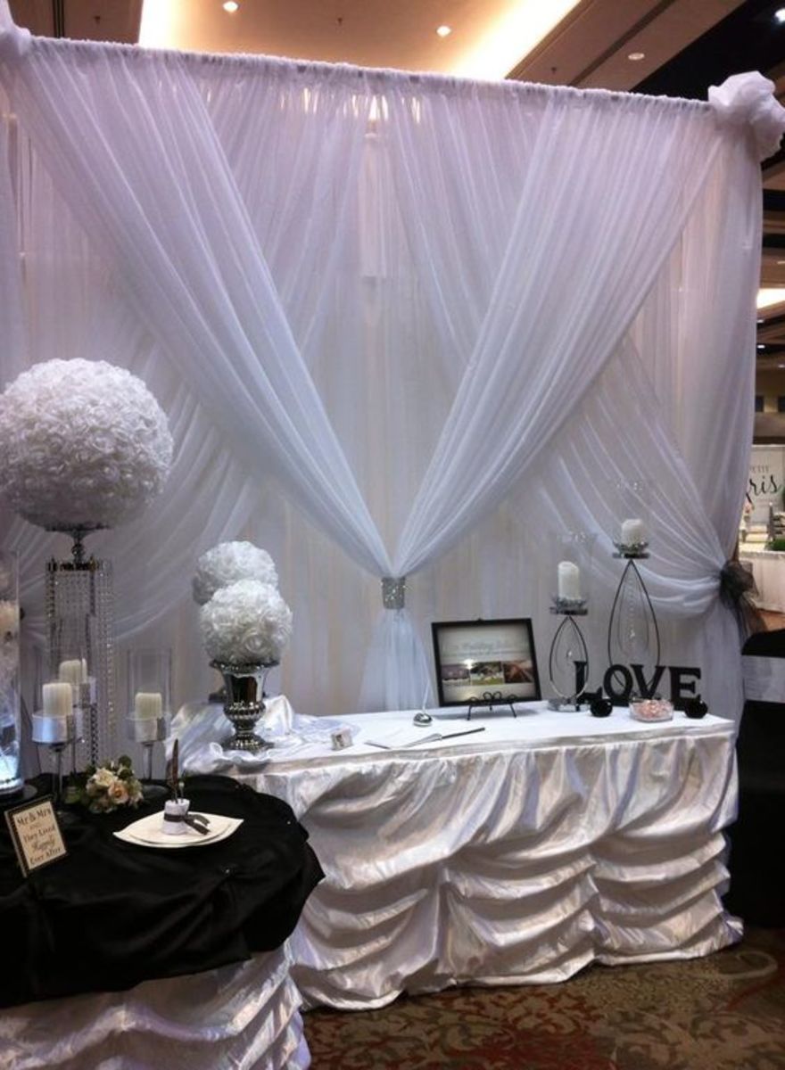Simple white chiffon backdrop for the reception area