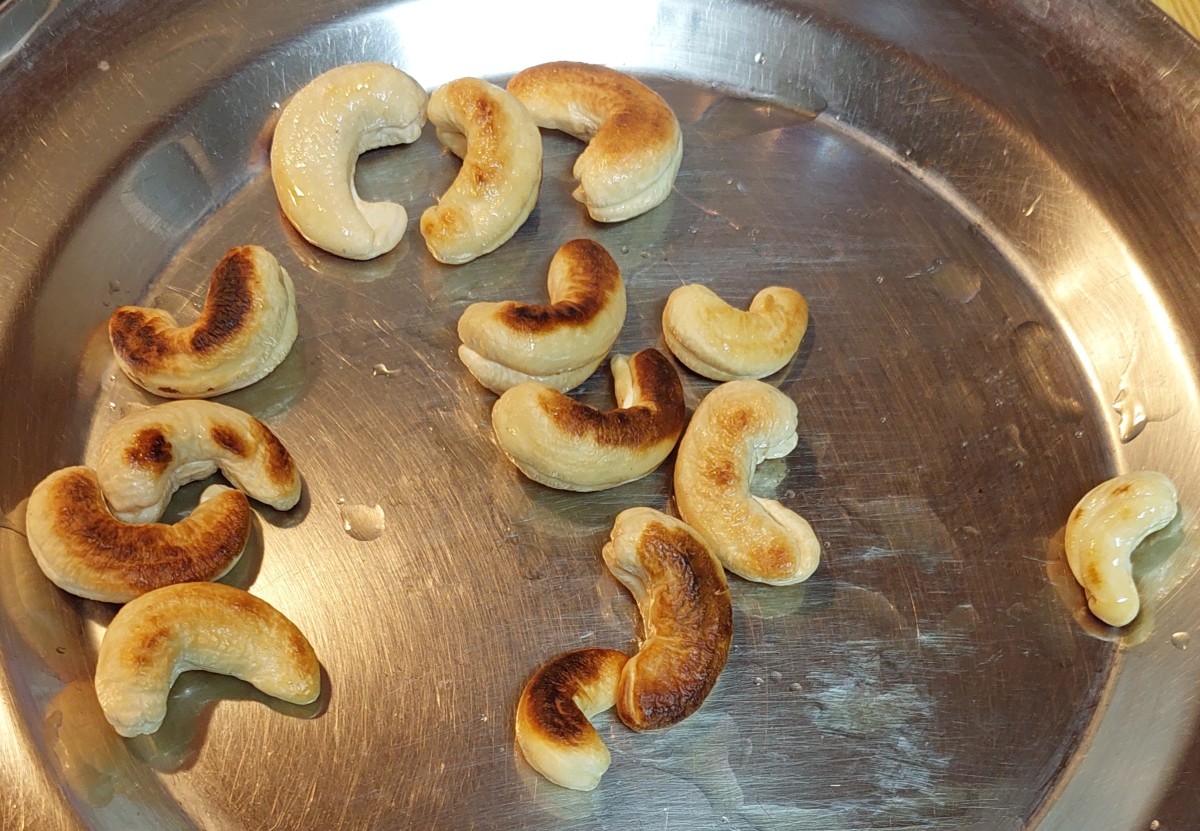 Fry over medium flame till cashews turn brown. Transfer to a plate and set aside.