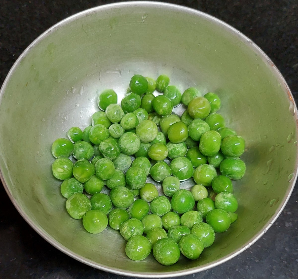 Wash 1/2 cup peas (fresh or frozen) and set aside.