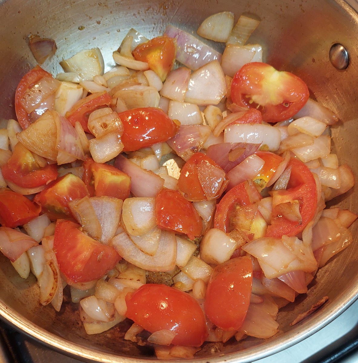 Add roughly chopped tomatoes and fry for a minute.