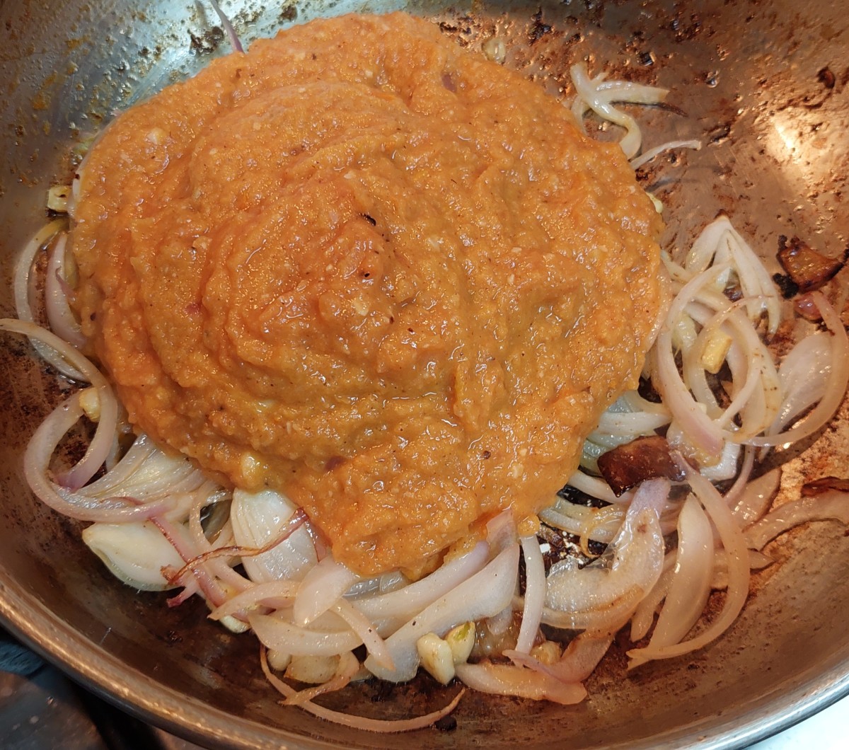 Add ground onion-tomato paste.