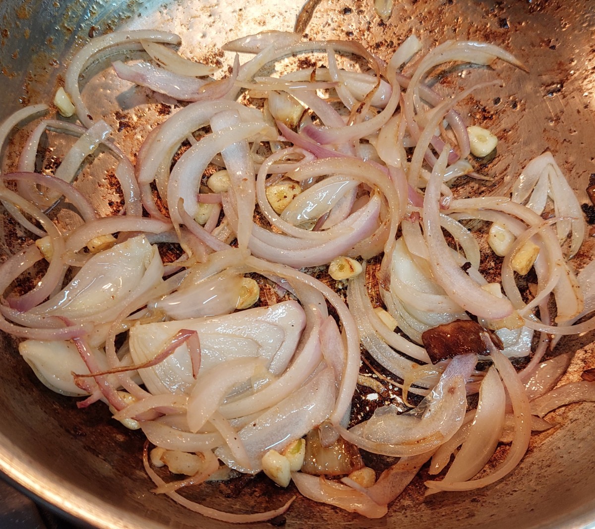 Add slit onions and saute for a minute