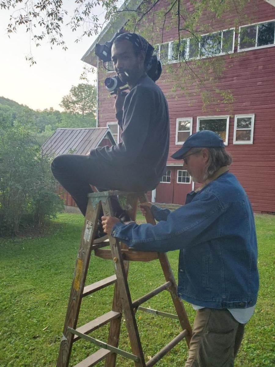 Cinematographer, R. Masseo Davis, pictured on ladder for 'Seeking Truth'