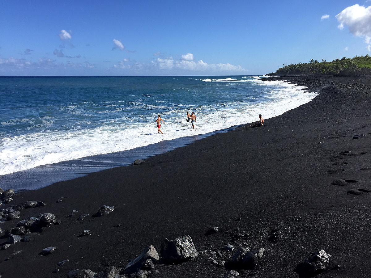 Frolicking in the surf at the new Pohoiki Black Sand Beach.
