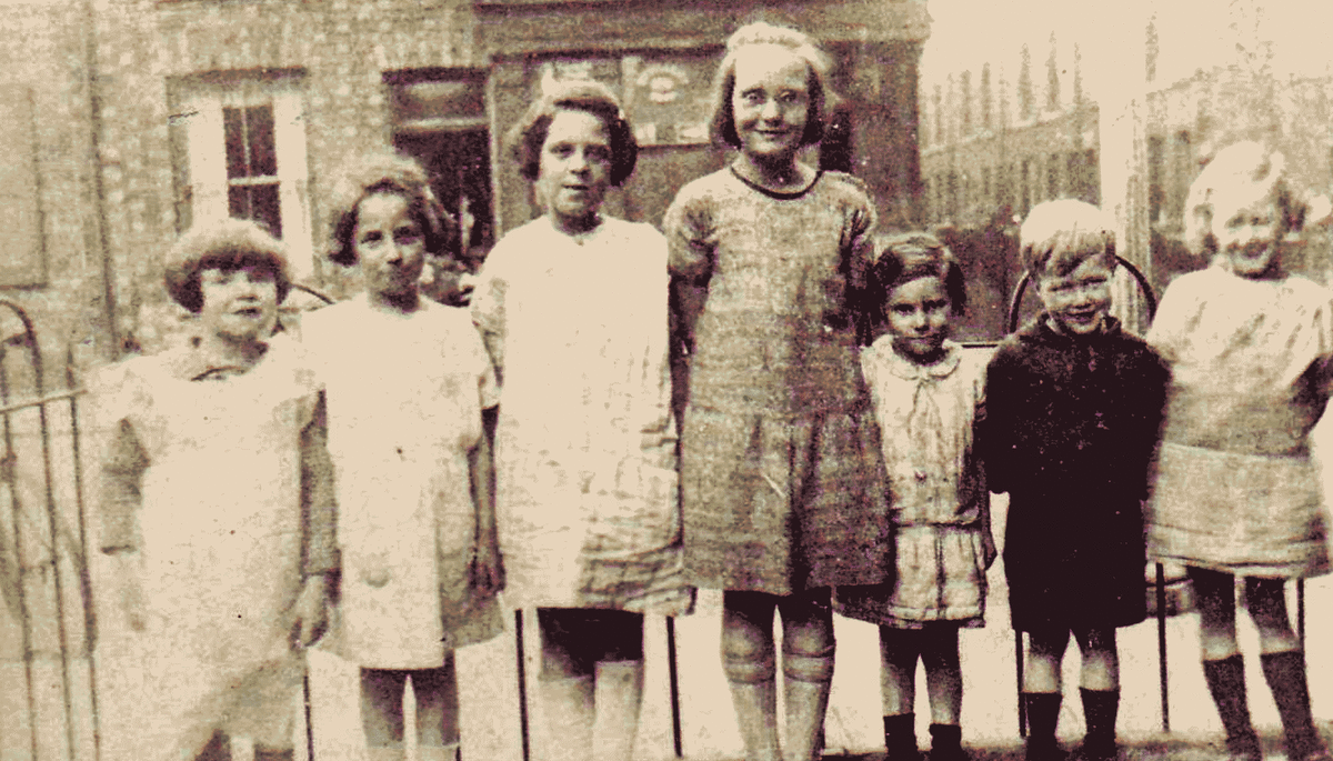 1920s UK. Mum is third from the left and her sister second from the left. They were not classed as poor as they all wore shoes and socks and my Grandad worked on the railways.