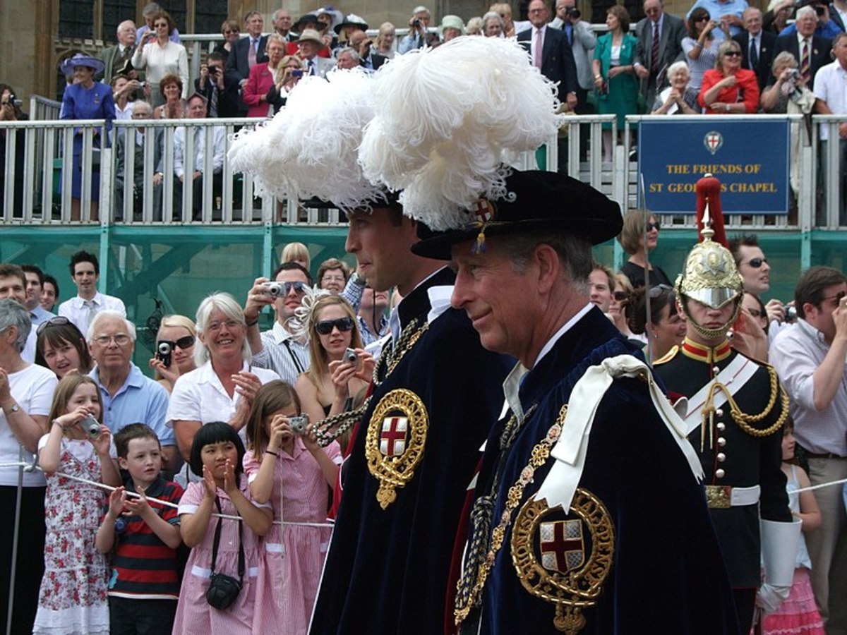 Charles, Prince of Wales and William, Duke of Cambridge bearing the Order of the Garter robes at the procession at Windsor.