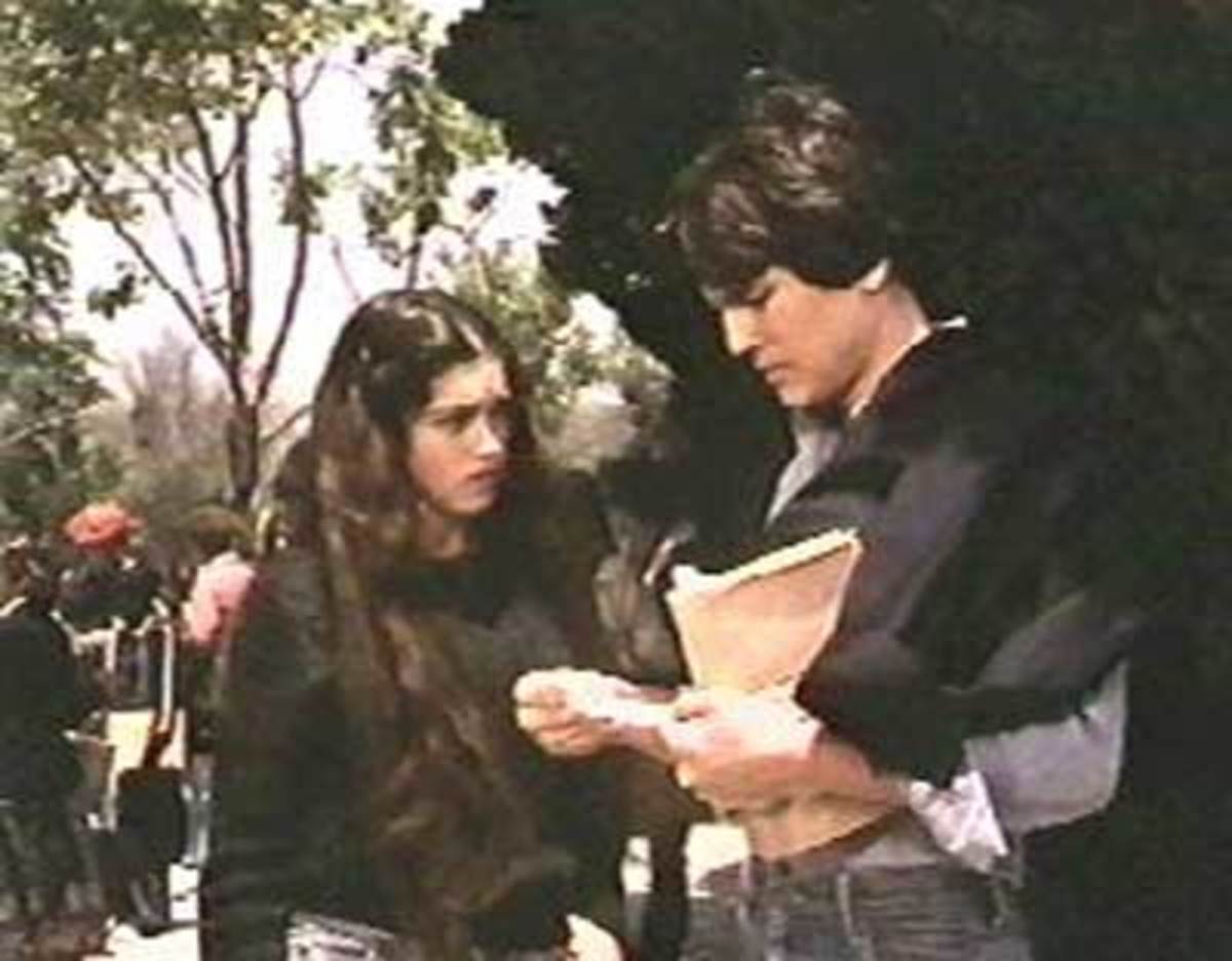 Steve (Scott Colomby) reads the mysterious note that Gail (Kathleen Beller) received in her locker