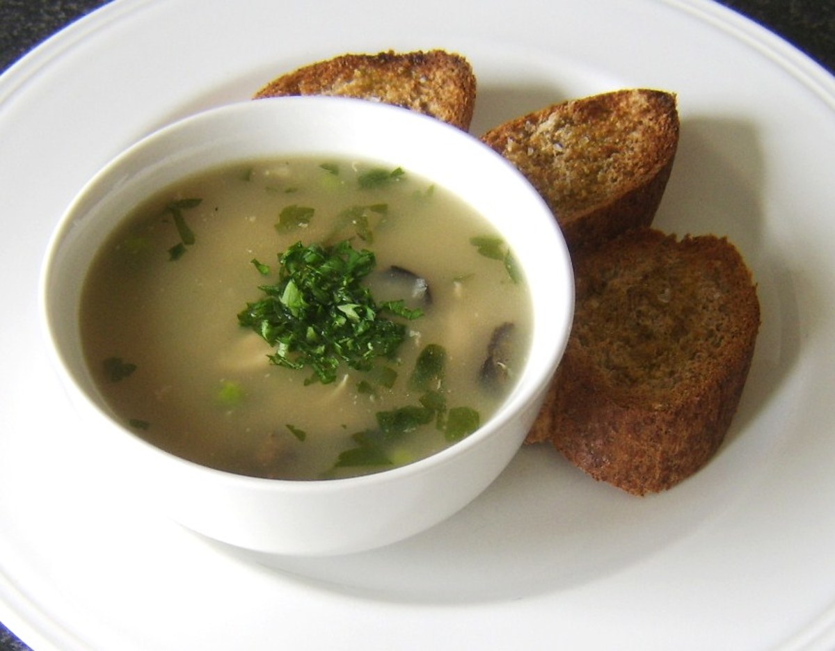 Chicken wings and mushroom soup is served with wholemeal toast
