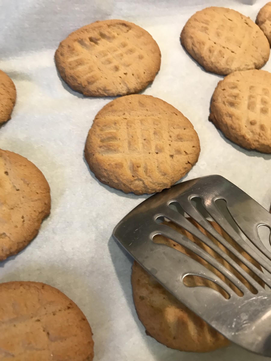 One trick to making the cookies come out perfectly round is the cookie scoop. Another is to wait about 60 seconds after they come out of the oven before transferring them to the wire rack to cool. This helps them set.