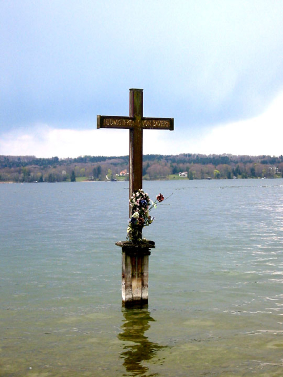 Ludwig II's memorial cross in Lake Starnberg, Berg Castle. 
