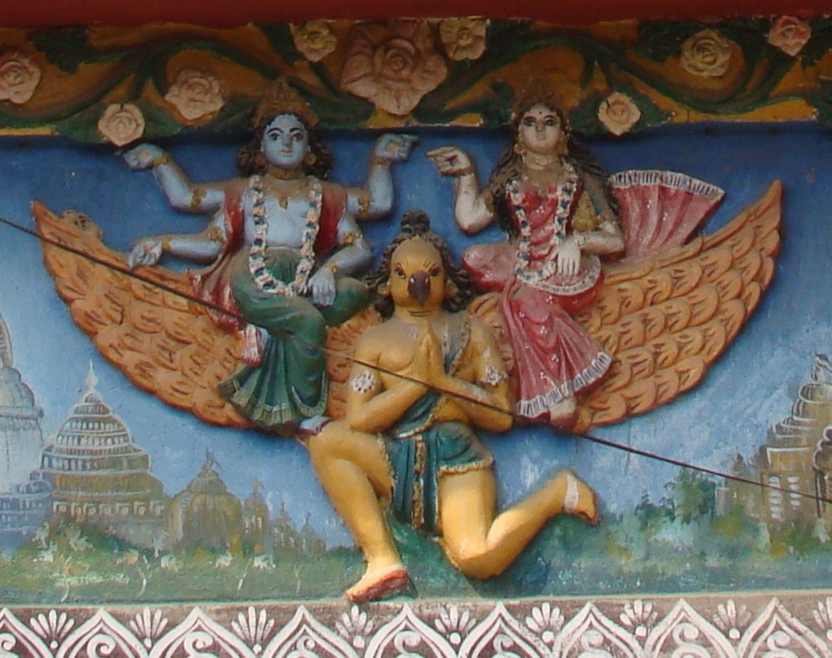 Lord Vishnu with his consort Lakshmi on Garuda; stucco (coloured)