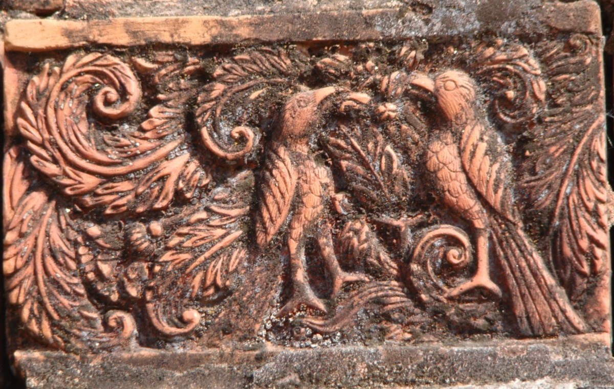 BIrd in terracotta plaque