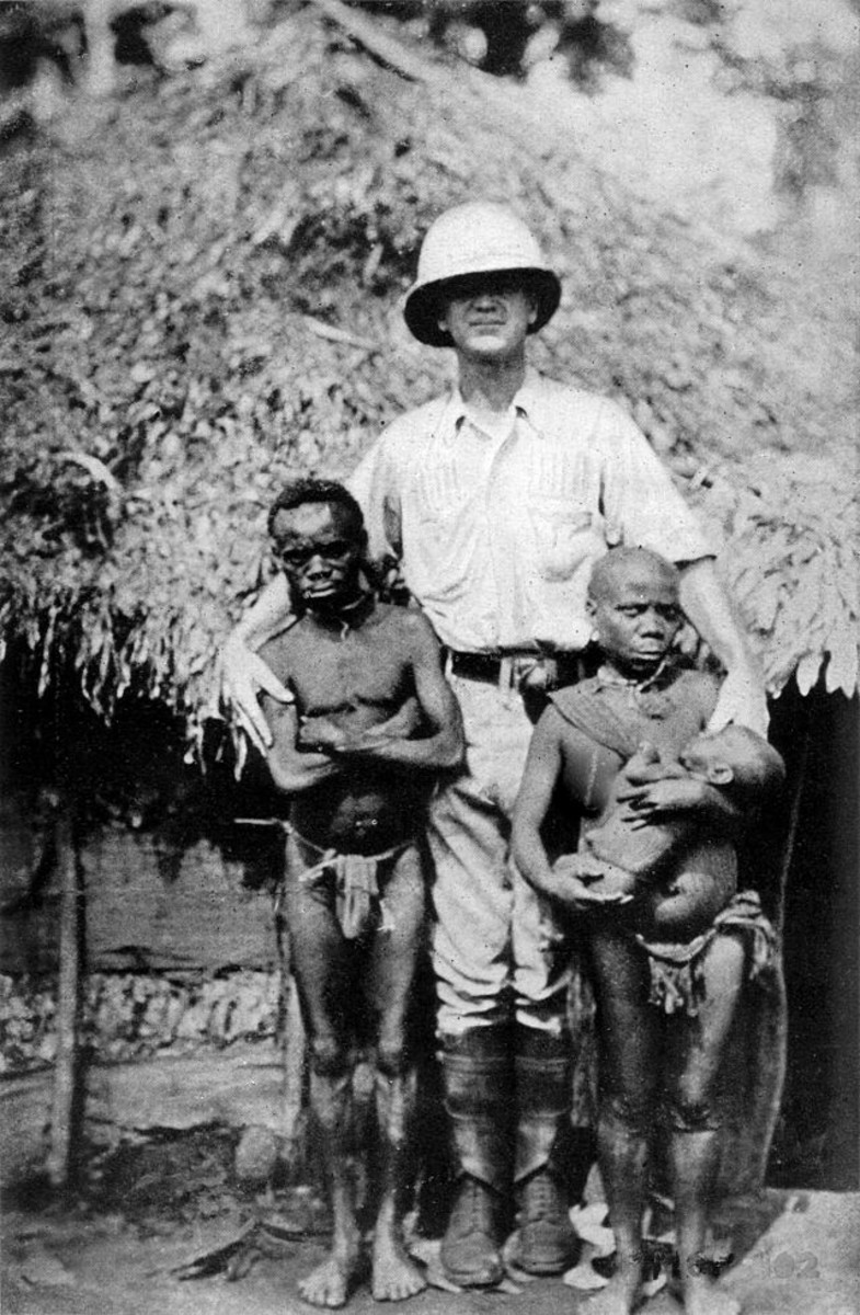 Pygmy family with a European explorer.