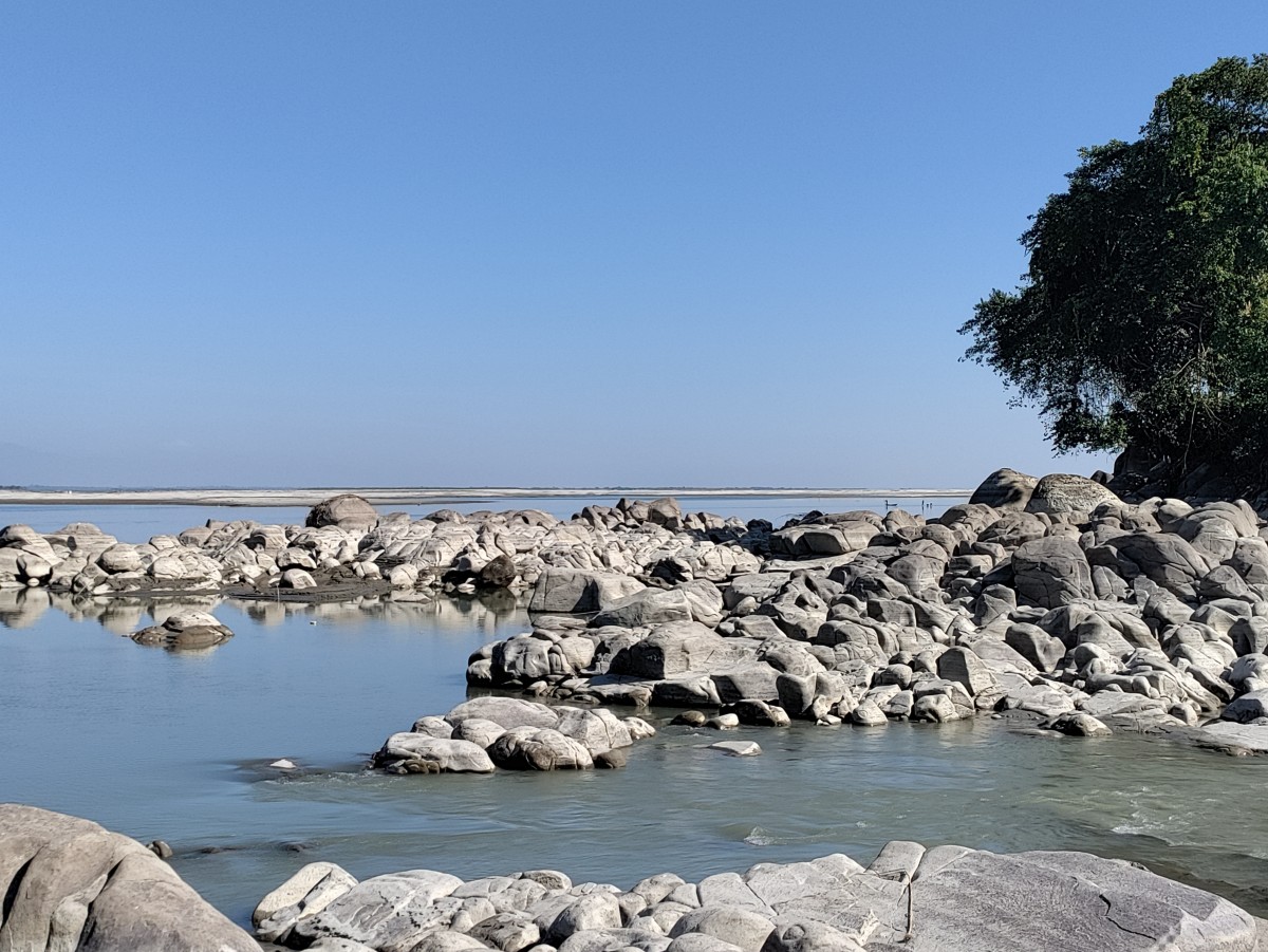 River Brahmaputra at Biswanath Ghat. The rocks in the river bed is regarded as Shivalingams.