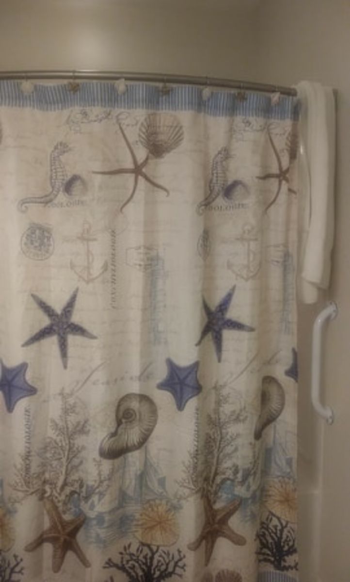 The towel, hanging on my shower curtain rod the way I always place it to dry.