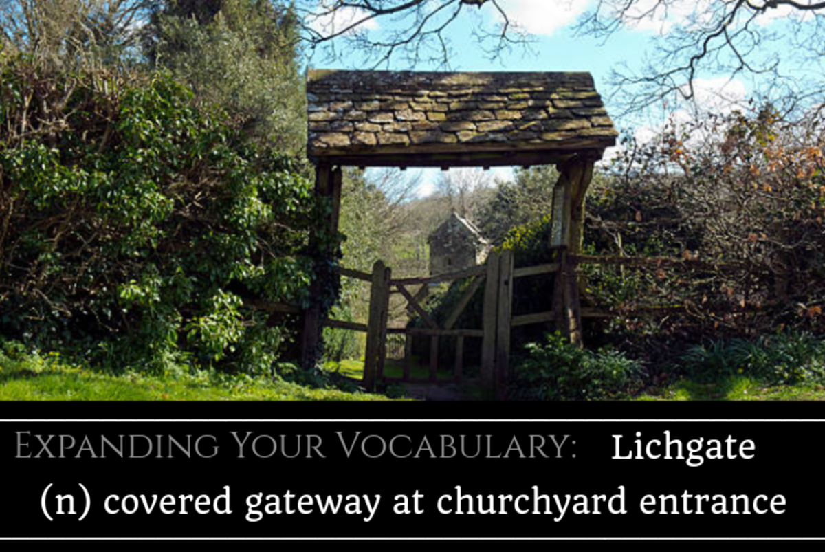 A covered gateway at a churchyard entrance. Lichgates are in front of burial grounds.