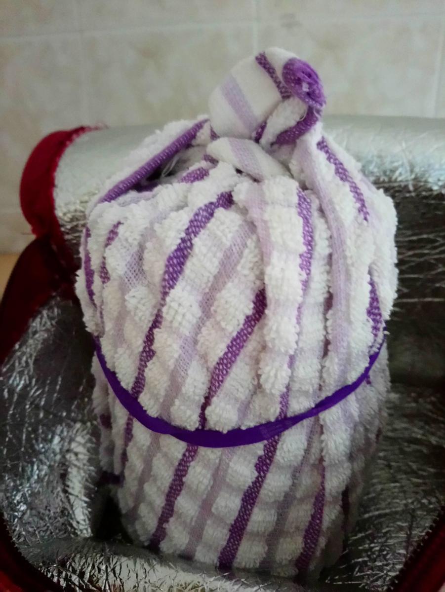 Wrap the jar of yogurt-to-be tightly with a towel/cloth to help keep it warm.