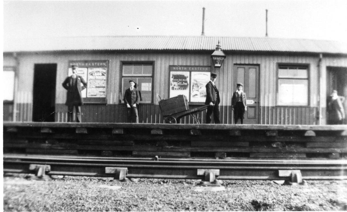 Eston Station staff and bystanders stand for the camera in early North Eastern Railway days (1902 -)