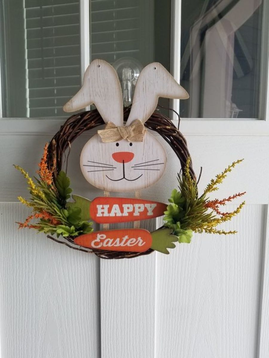 This piece combines wreath forms with wooden bunny shapes, plus some faux greenery.