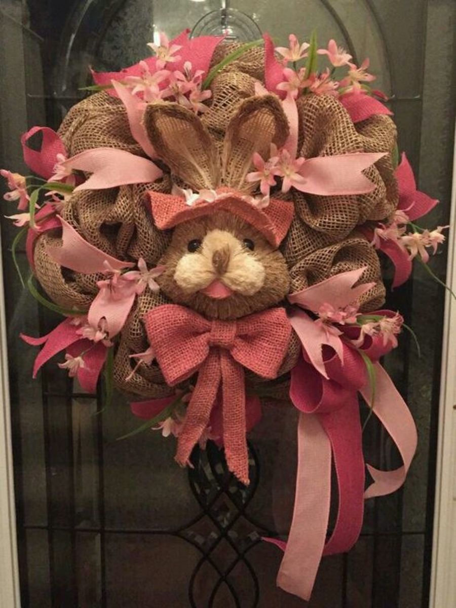 This wreath is made from burlap, and it's absolutely covered with pink ribbons. Place a stuffed bunny in the center for a real Easter look!
